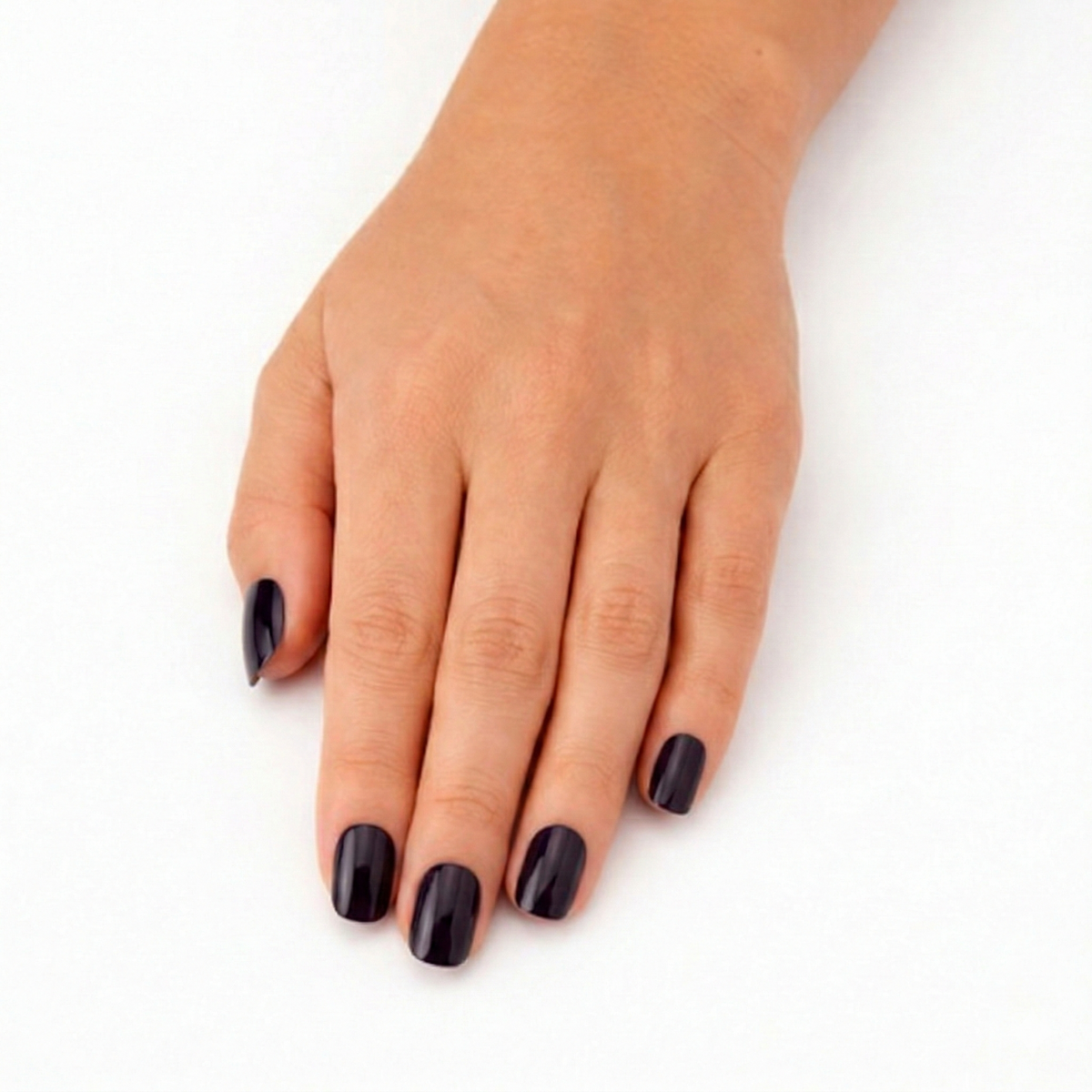 Hand wearing Ink Heart inky midnight blue nail polish wraps