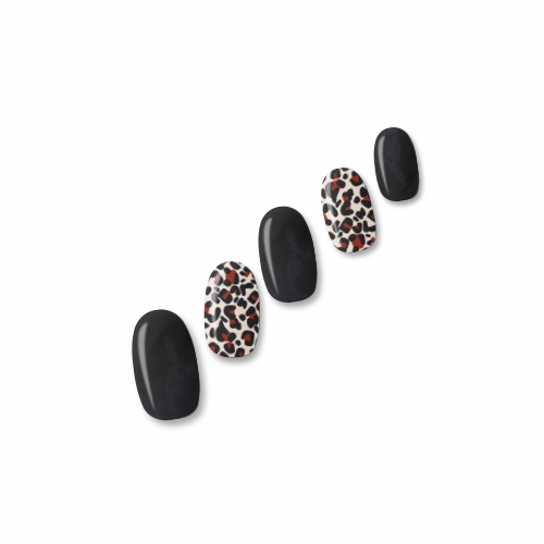 Jungle Fever animal print nail polish wraps in nude tones with solid black nails shown on five nail tips