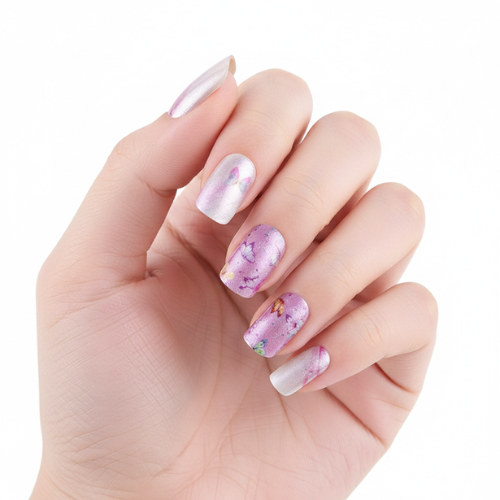 Hand wearing Kaleidoscope pink and lilac marble butterfly nail polish wraps