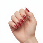 Hand wearing Norma Jean deep maroon and gold glitter nail polish wraps