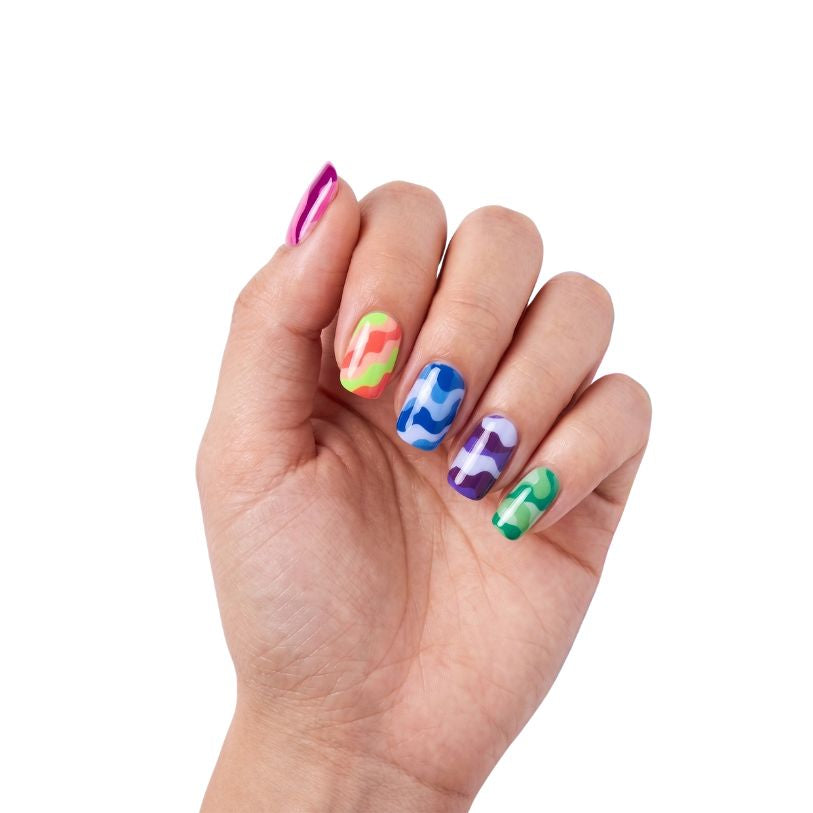 Hand wearing Now U C Me neon colour-blocked camo nail polish wraps