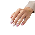 Hand wearing Petulia pearlescent white confetti nail polish wraps