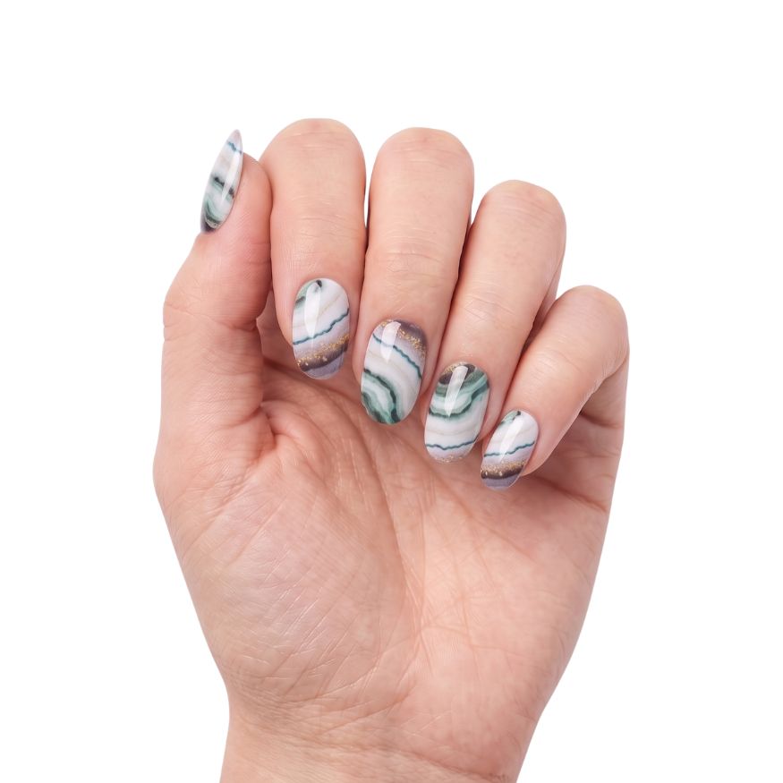 Hand wearing Treasure Hunt teal, lilac and white agate nail polish wraps