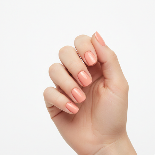 Hand wearing Tutu glossy soft peachy-pink nail polish wraps