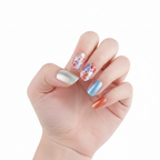 Hand wearing Wild Flowers floral and pastel nail polish wraps