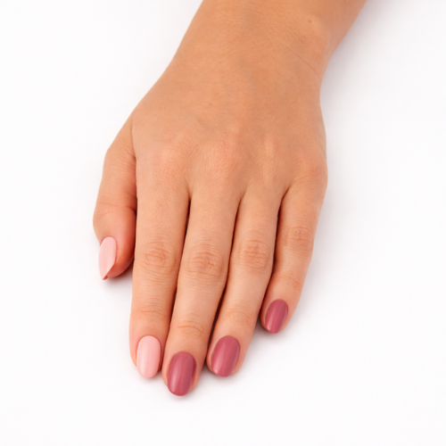 Hand wearing Autumn Pinks rose and berry nail polish wraps