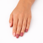 Hand wearing Autumn Pinks rose and berry nail polish wraps