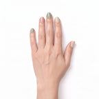 Hand wearing Swirl sage green, cream and blush pink nail polish wraps