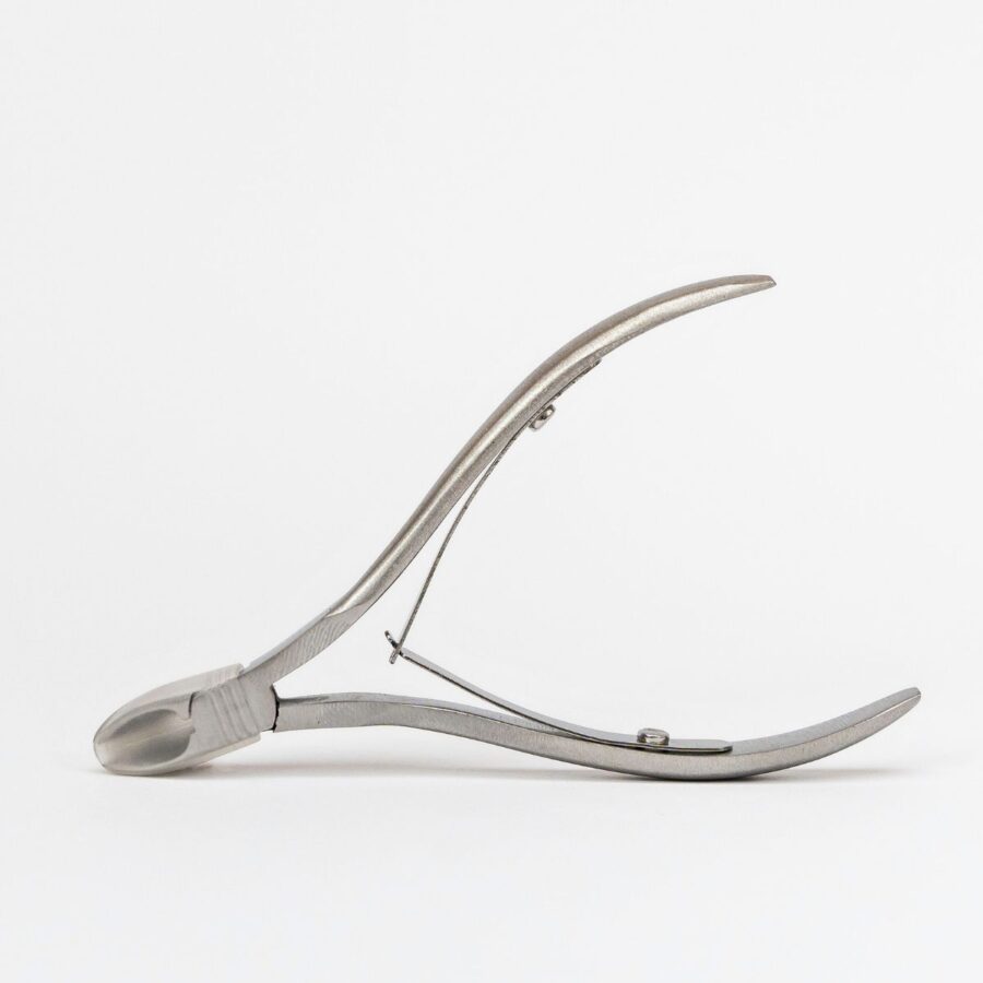 Steel cuticle clipper that comes with a small cap for protection against the pointy edge.