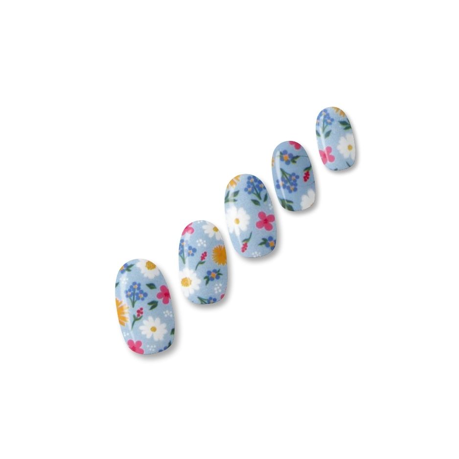 Gel With Us Flower Market Nail Wraps strip showing a ditsy floral print with daisies, marigolds and pink blooms on a cornflower blue base.
