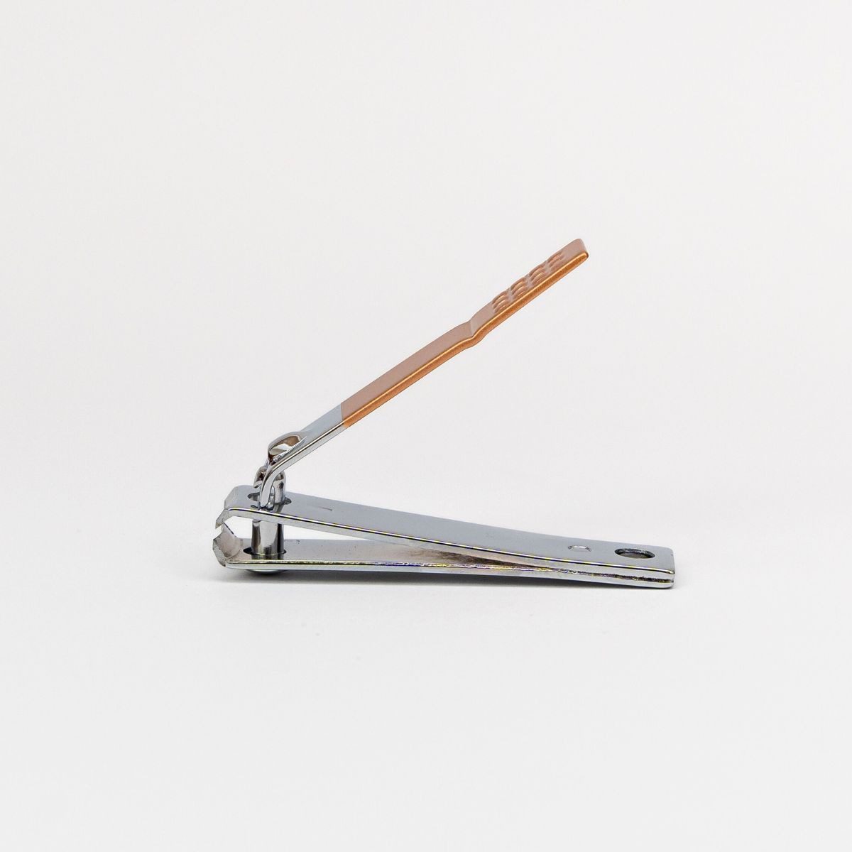 Small metal nail clipper finished off with bronze detailing on the handle.