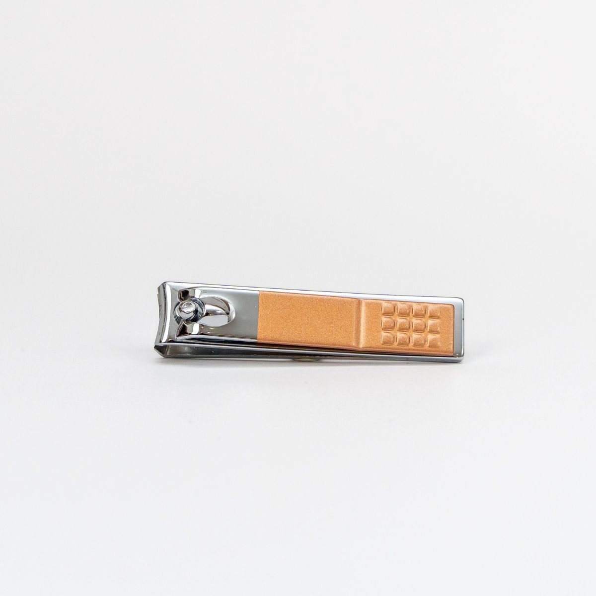 Small metal nail clipper finished off with bronze detailing on the handle.